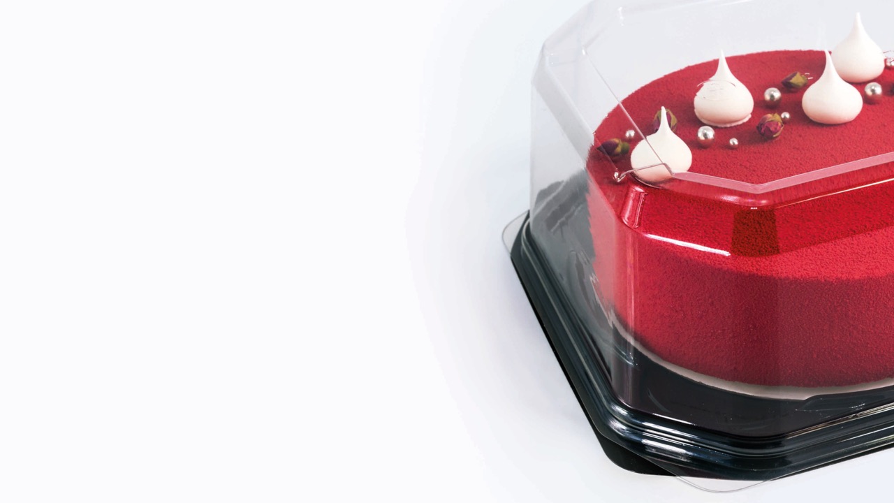 Cake in a clear dome container